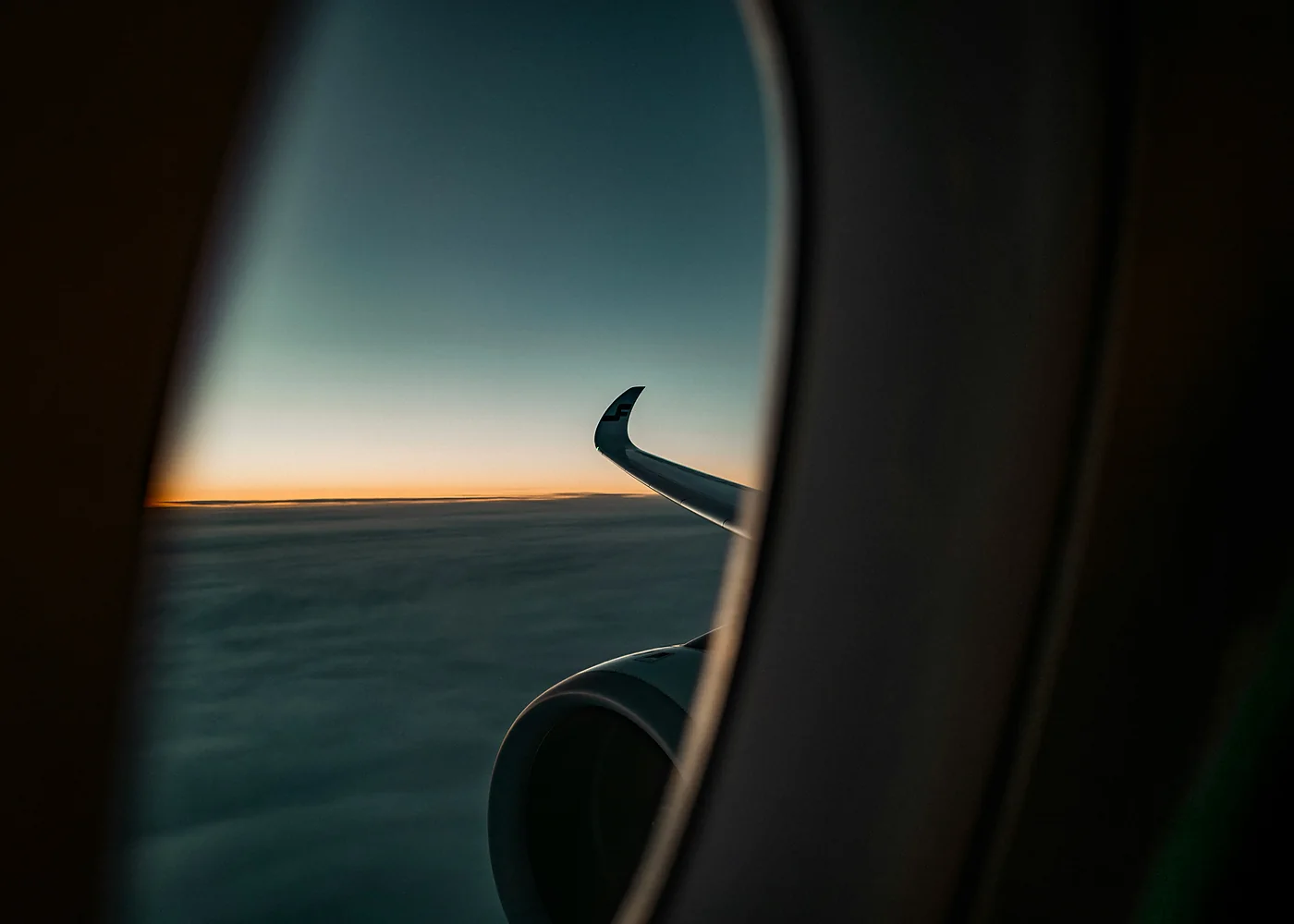 Aircraft wing over clouds